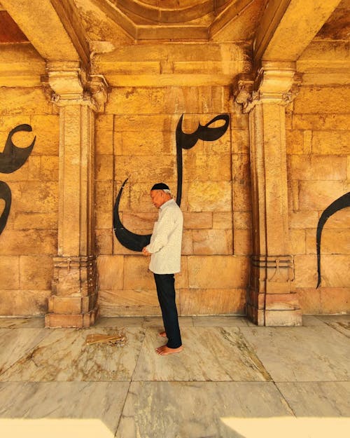 Side View of a Man Standing by the Wall in the Jama Mosque, Ahmedabad, India 