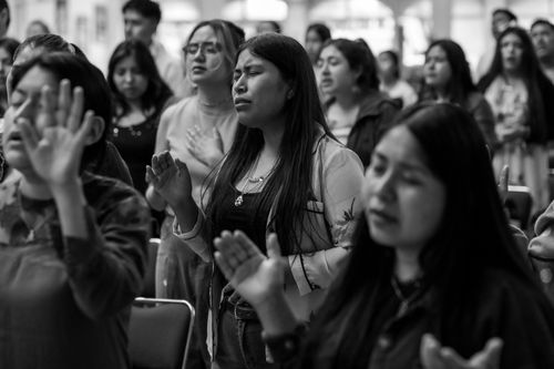 Free A diverse group of women and men in prayer at a gathering in Ciudad de México, CDMX, México. Stock Photo