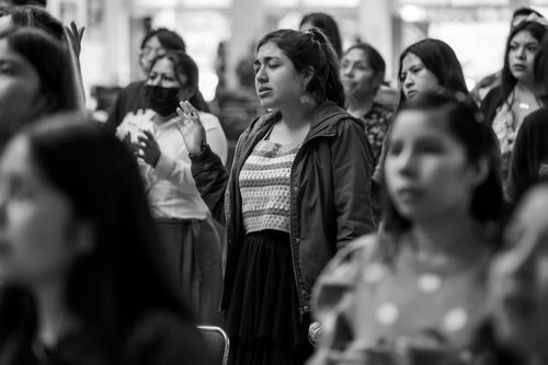 Free Black and white image of women praying at a religious gathering in Ciudad de México. Stock Photo