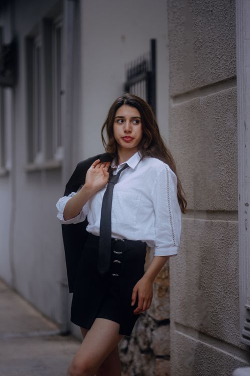 Free Stylish woman in urban setting with chic fashion and classic appeal. Stock Photo