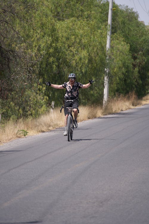 A man riding a bike on a road