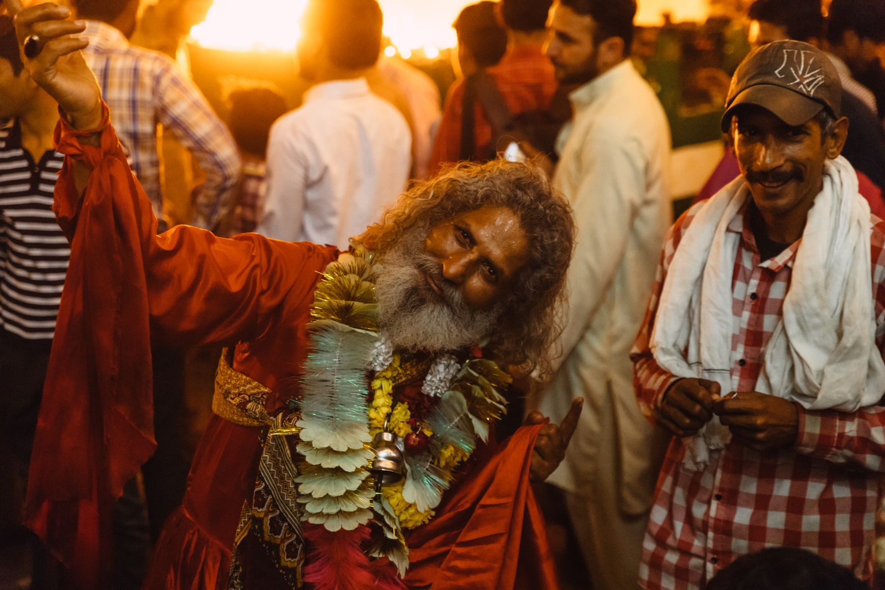 Vibrant cultural festival scene with people in traditional attire, Lahore.