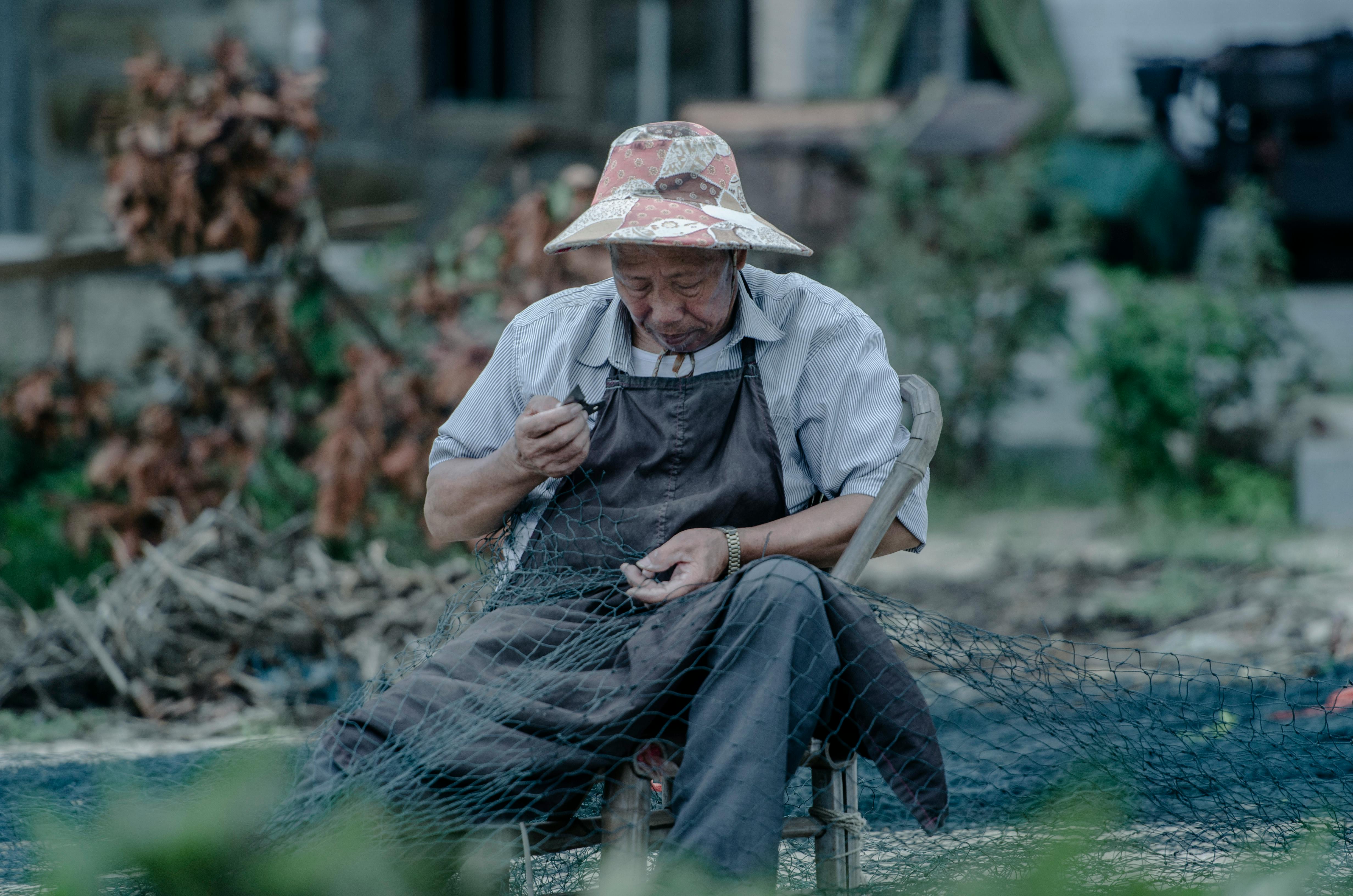 photo of a man holding a fishing net