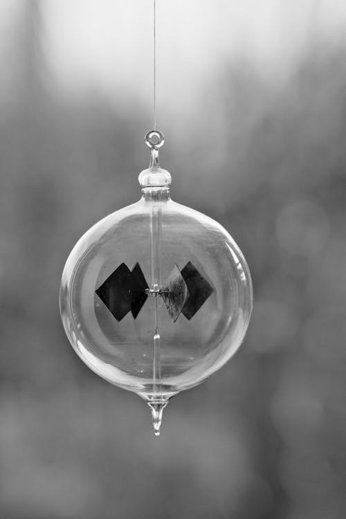 A black and white photo of a glass ornament
