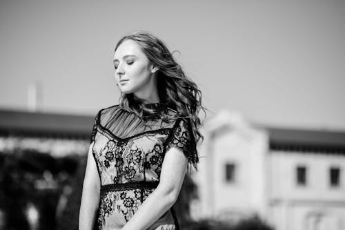 Free Woman Standing in Dress in Black and White Stock Photo