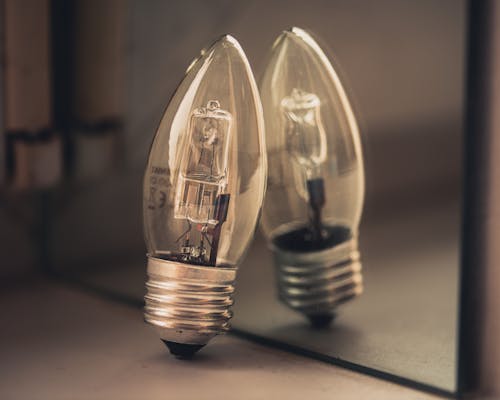 Macro photo of the bulb with reflection in the mirror