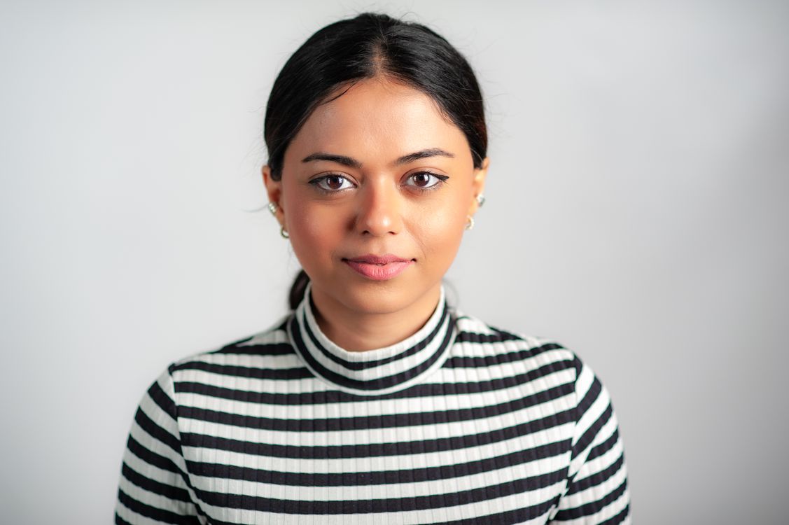 Portrait of a Woman in a Striped Blouse · Free Stock Photo