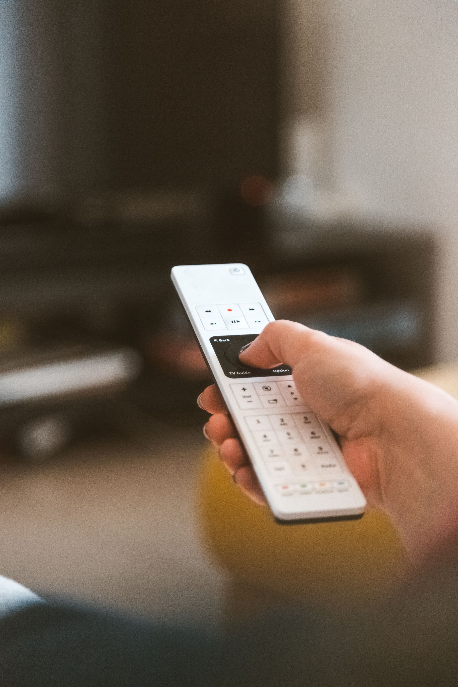 Grayscale Photo of Remote Control Near Eyeglasses · Free Stock Photo