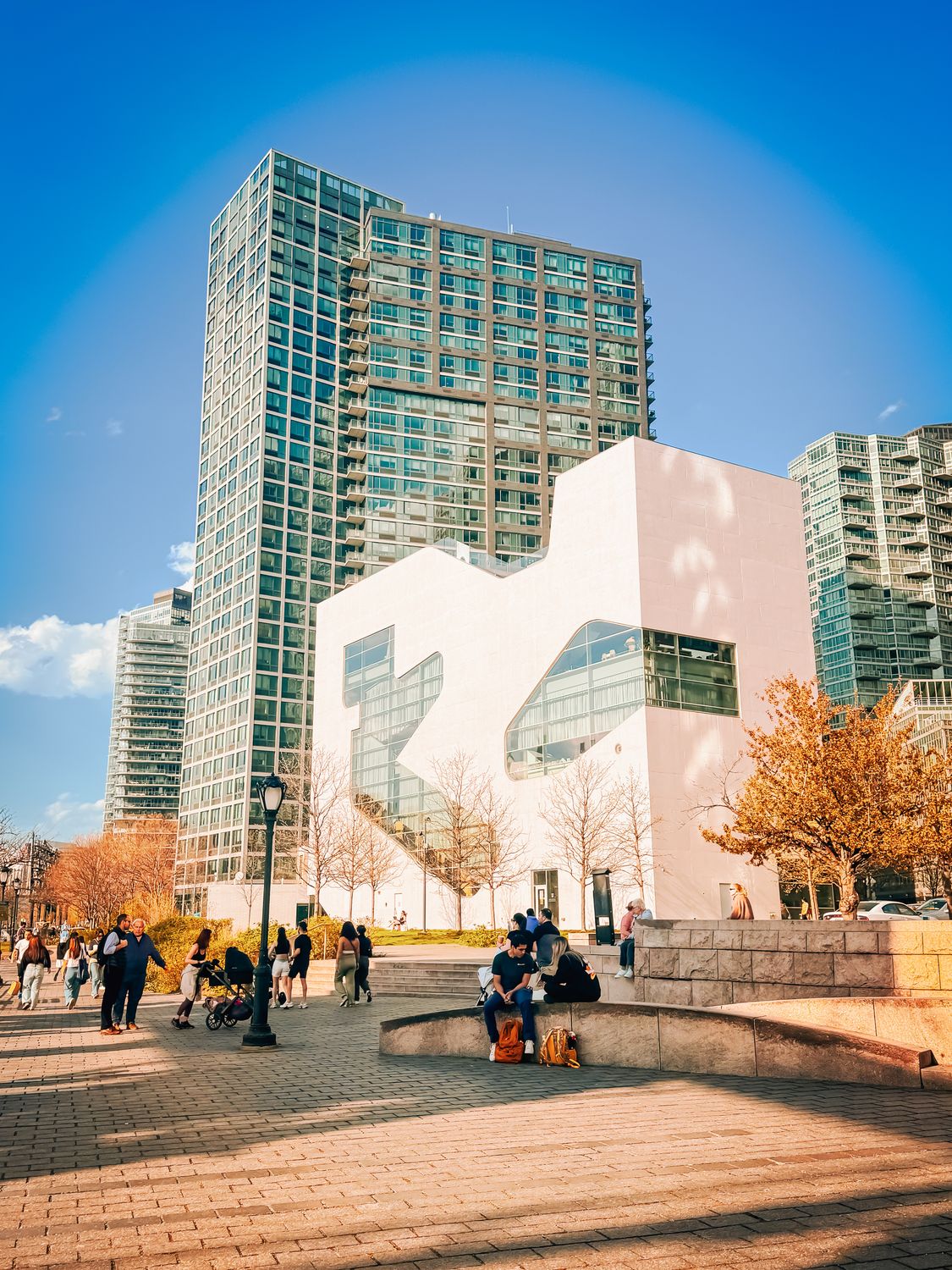 Sunny Plaza in front of High Rise Glass Buil · Free Stock Photo