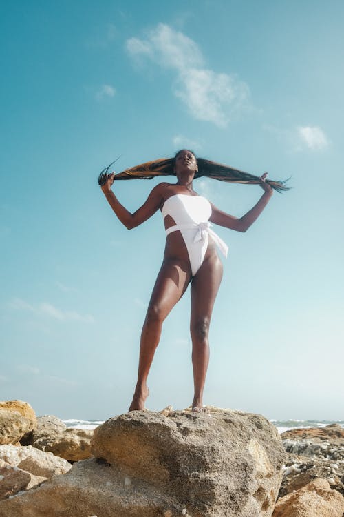 Brunette Standing Woman in Bikini on Rock