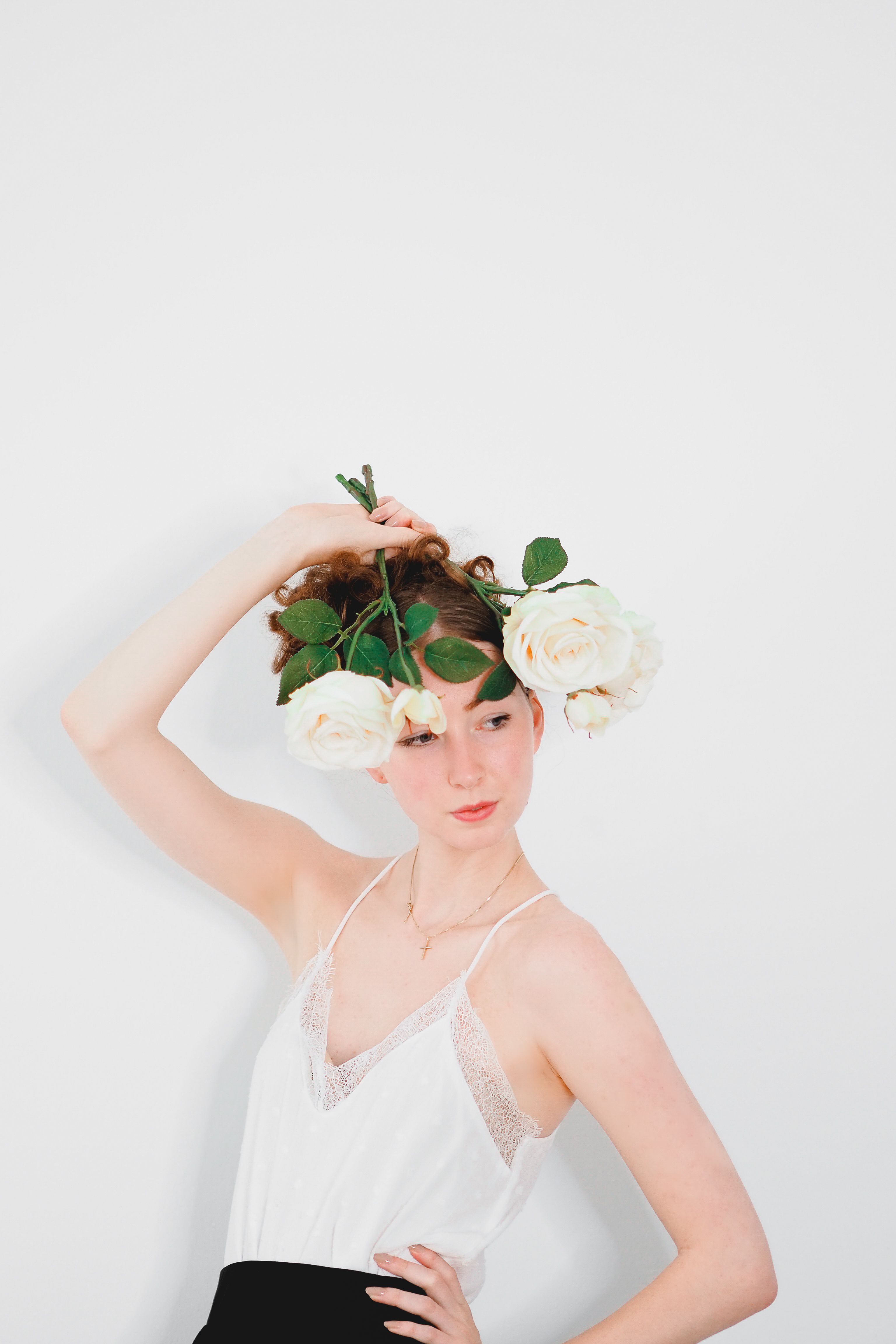 Model with Roses Posing in White Blouse · Free Stock Photo