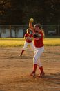 Girl Wearing Baseball Mitts Holding Soft Ball