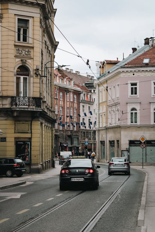 A car driving down a street in a city