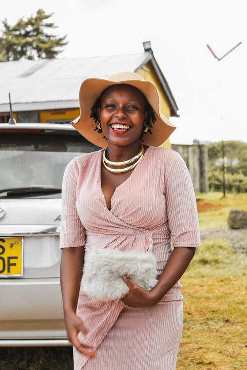 Smiling Woman Beside Vehicle