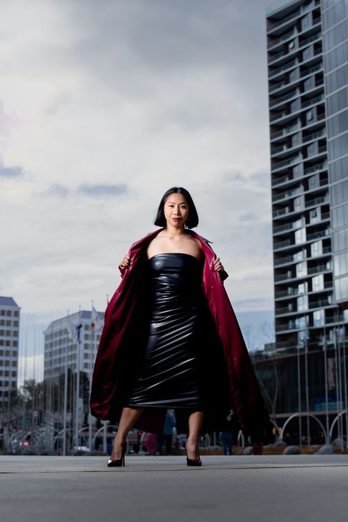 Free Fashionable woman in elegant attire in San Francisco's urban landscape. Stock Photo