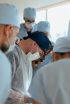 A focused team of surgeons in an operating room performing a complex medical procedure.