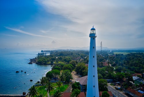 Scenic Photo Of Lighthouse Near Sea
