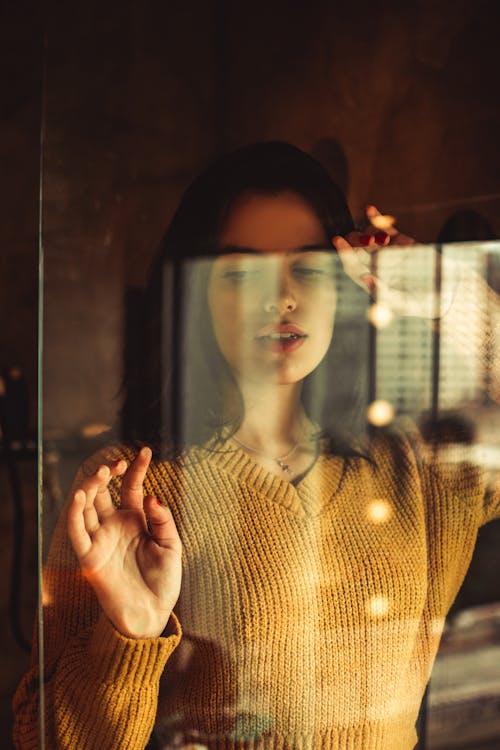 Photo Of Woman Leaning On Glass