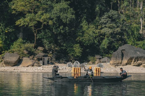 A boat with people on it near a river