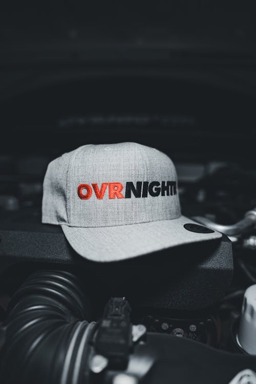 A hat with the word over night on it