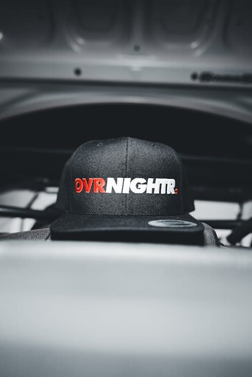 A hat with the word dwn night on it