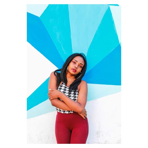 Free Woman Standing In Front Of Wall Stock Photo