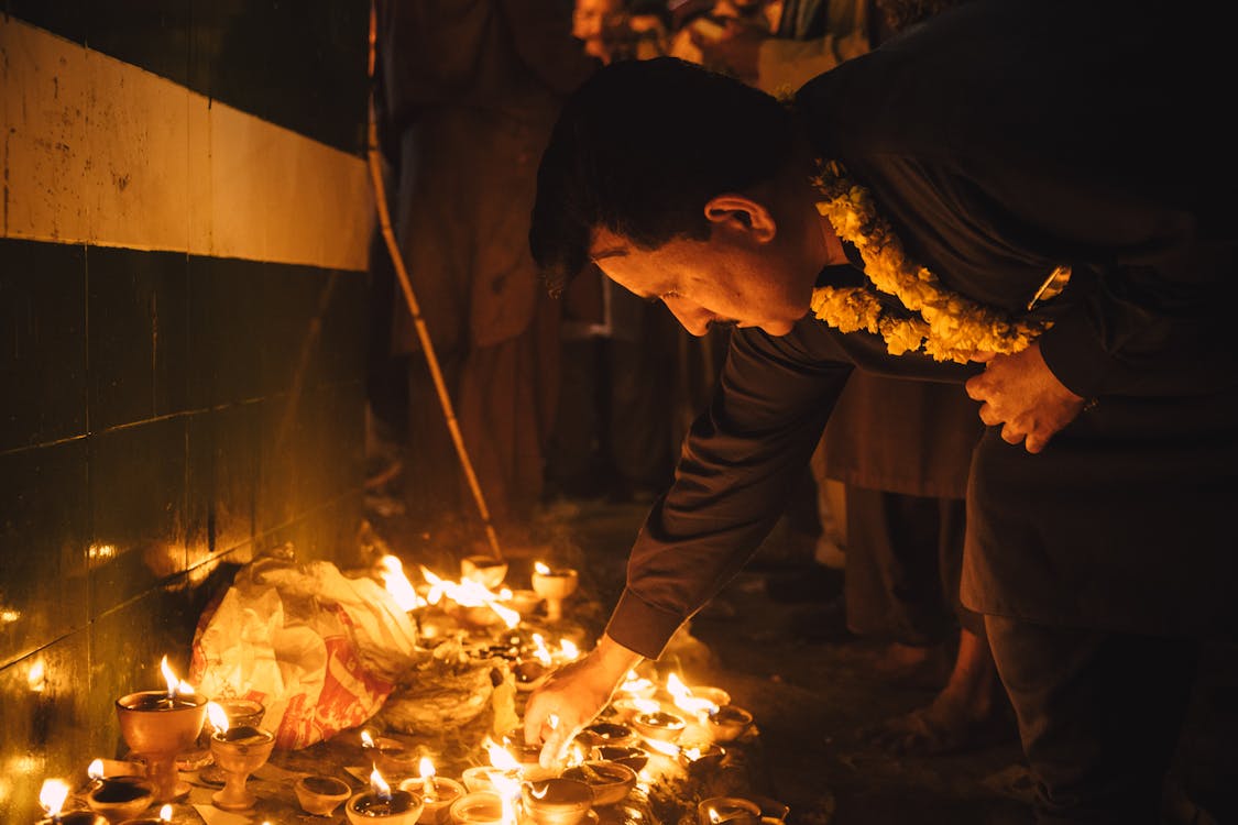 Person Looking at Candles