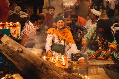 Free Men Sitting During A Celebration Stock Photo