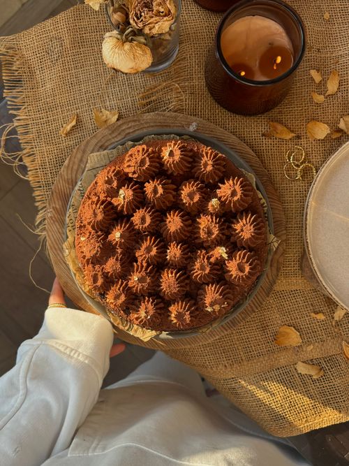Free Delicious chocolate cake on a burlap-covered wooden table, creating a cozy and rustic atmosphere. Stock Photo