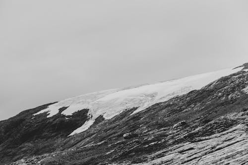 Black and white photo of a snow covered mountain