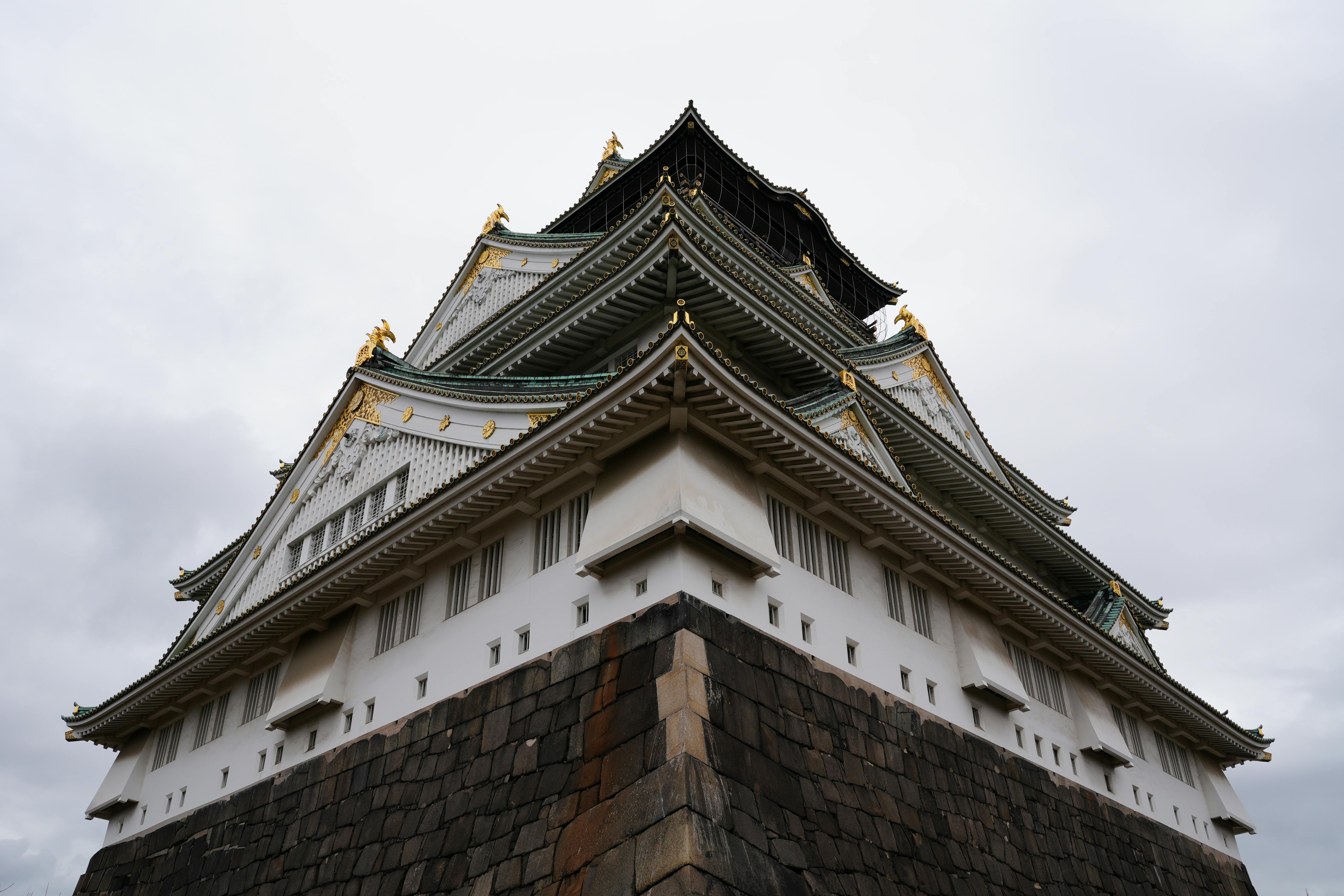 stunning view of osaka castle showcasing its traditional japanese pagoda-style architecture.