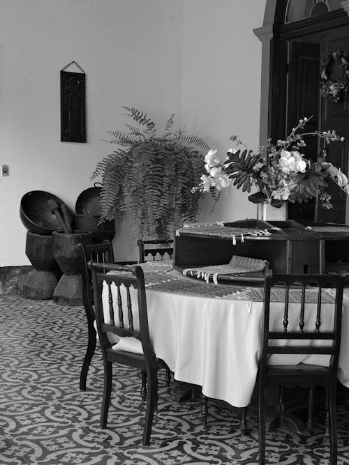 A black and white photo of a dining room
