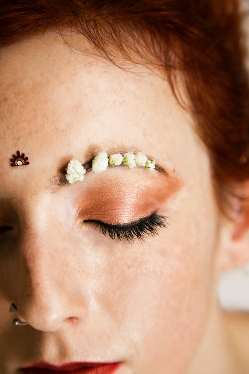 Free Flowers on Woman Eyebrow Stock Photo