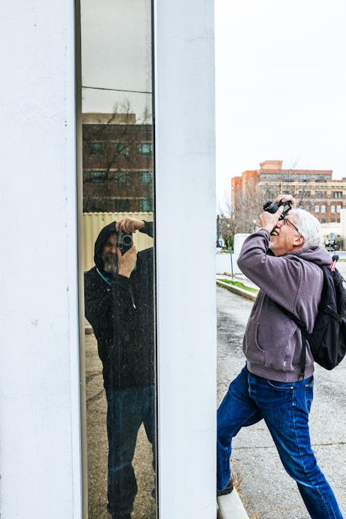 A man taking a picture of himself in a mirror