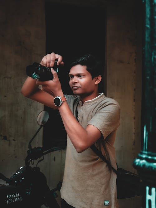 A man taking a picture of a motorcycle