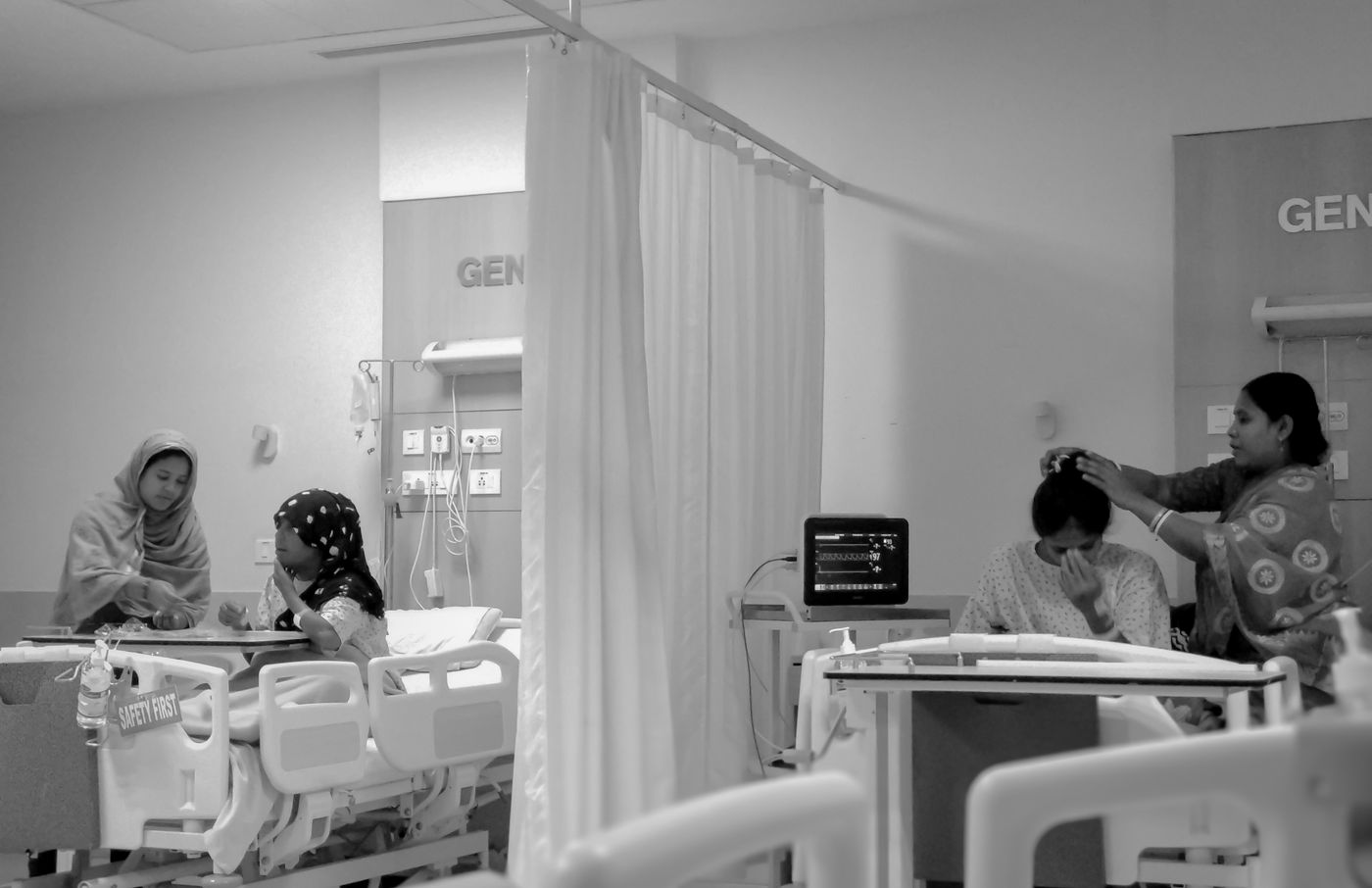Patient in an Indian hospital bed during post-surgery dressing care Patient in an Indian hospital bed during post-surgery dressing care