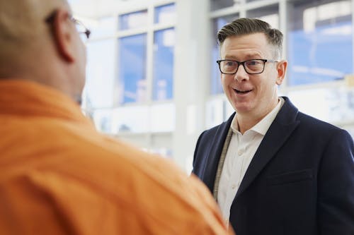 Free Two Men Talking on Focus Photography Stock Photo