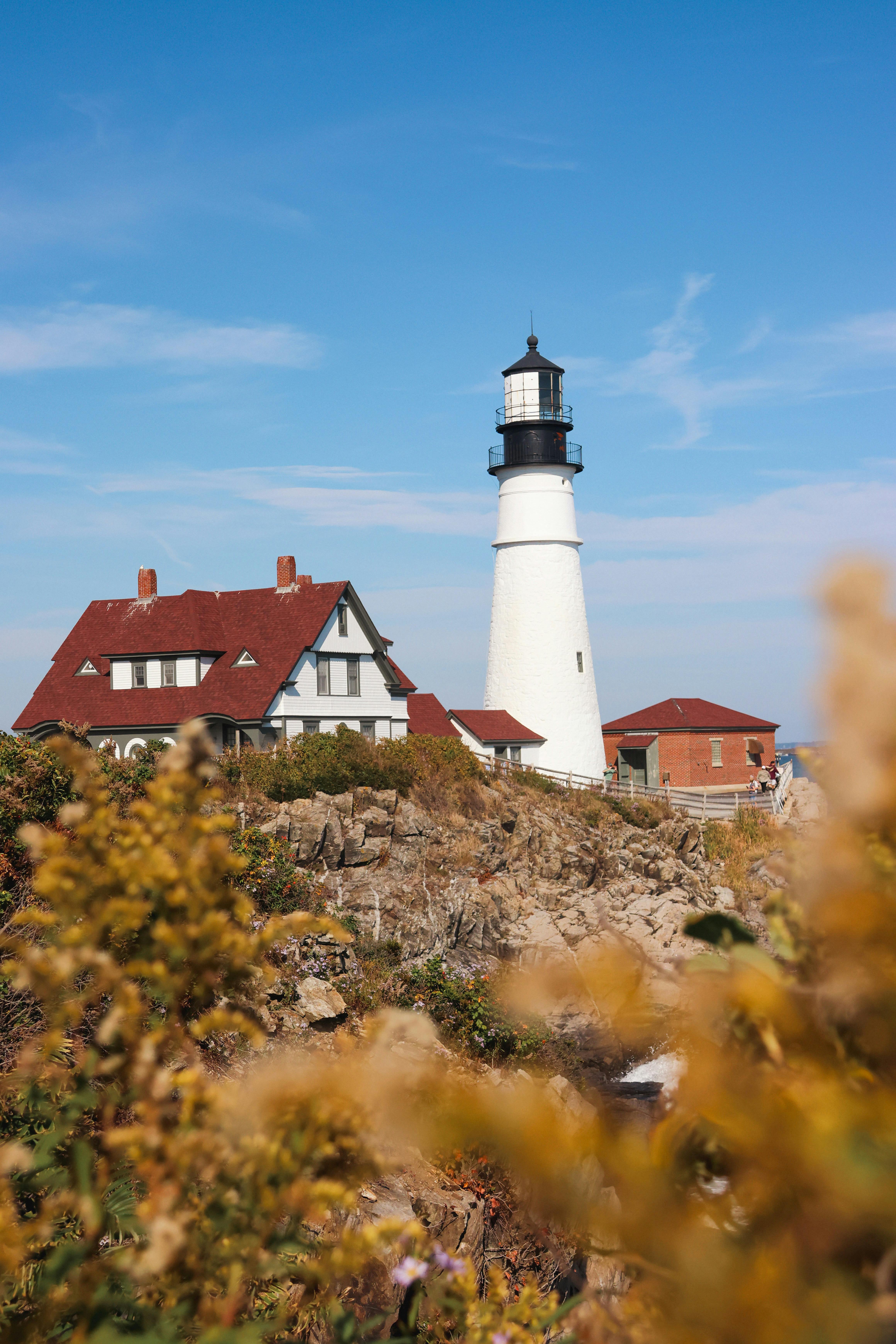 Classic view of Portland Head Light with a clear blue sky in Cape Elizabeth, Maine.