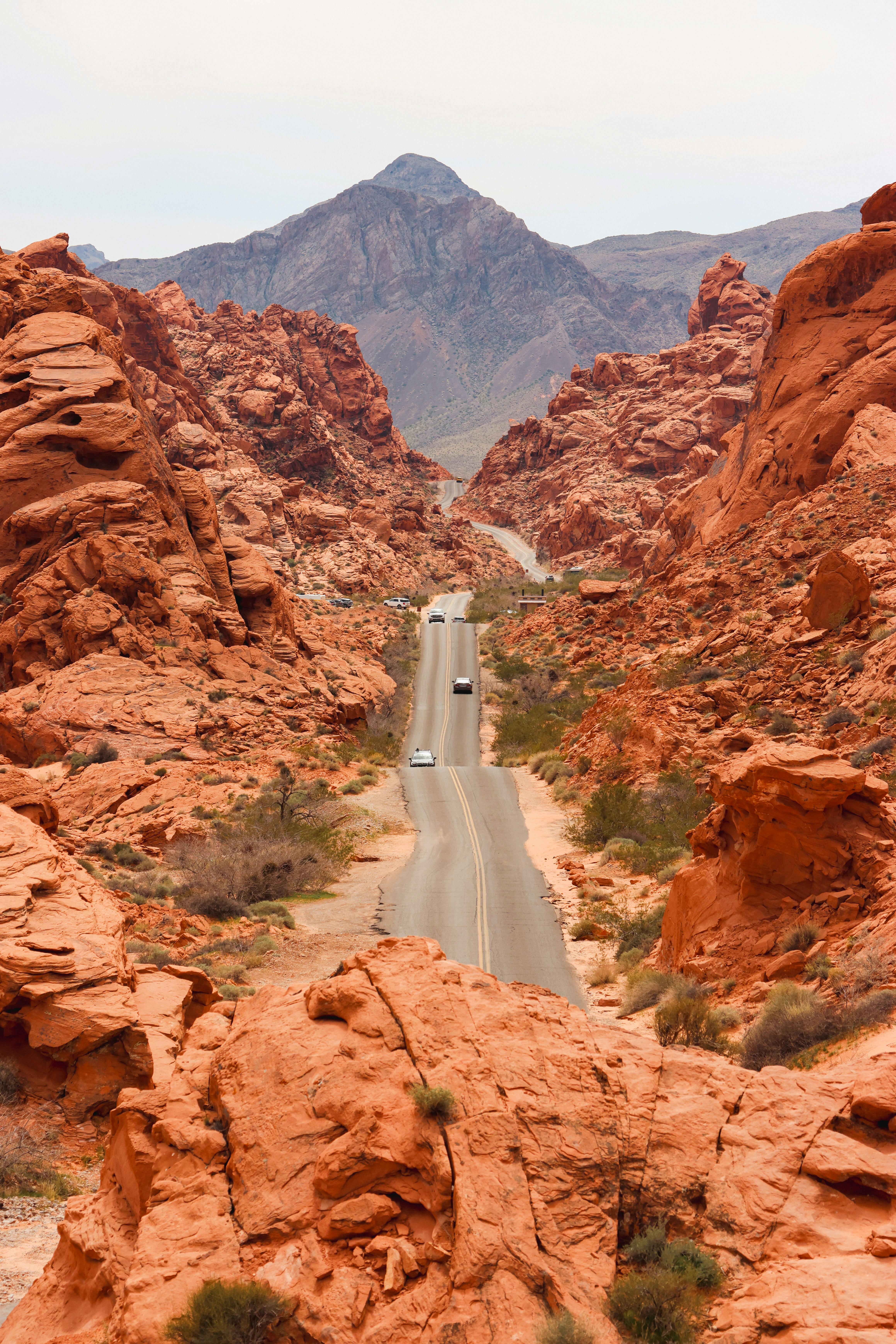 A winding road through the vibrant red rock formations of Moapa Valley, NV, USA.