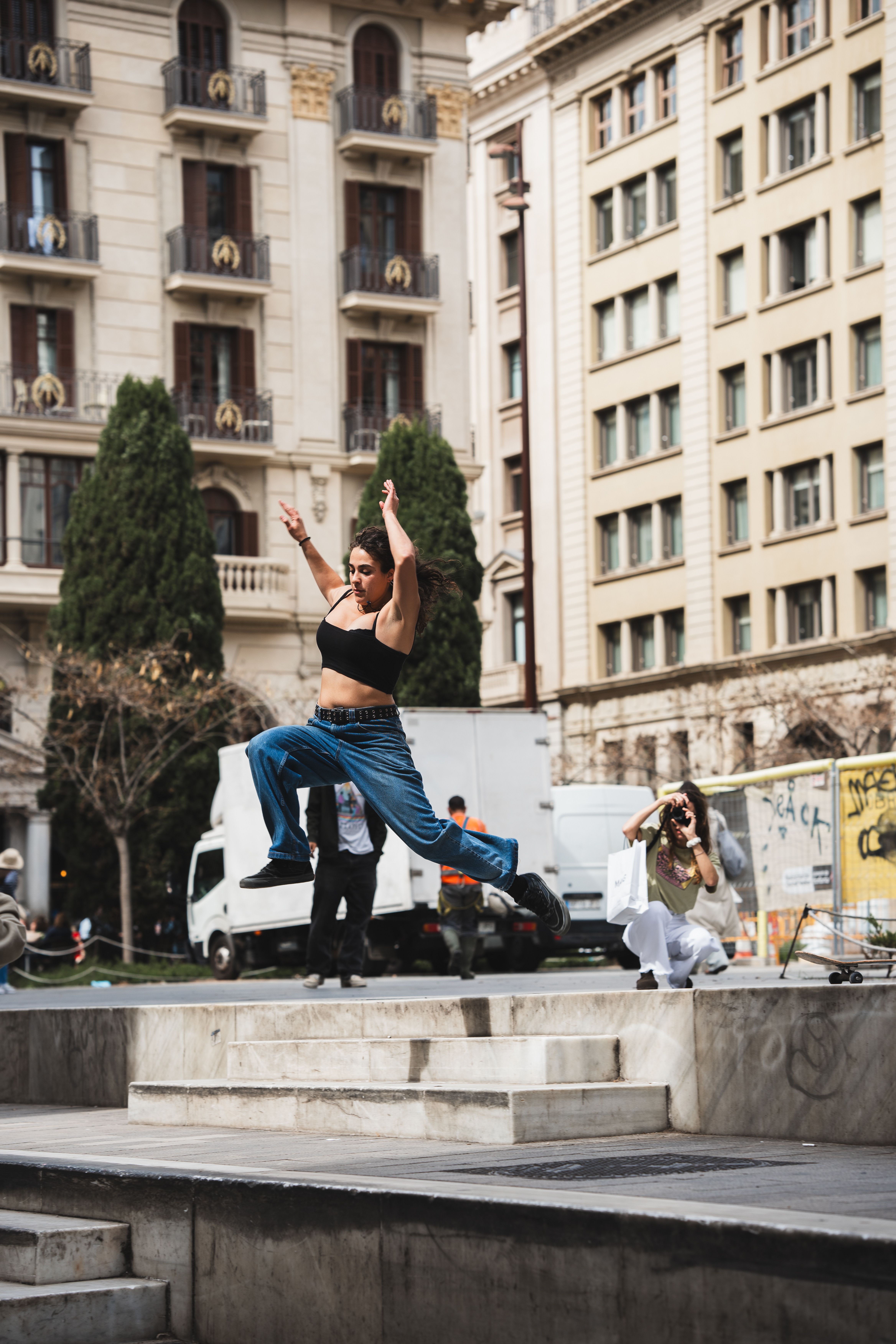 A Woman Jumping over the Steps in a City · Free Stock Photo