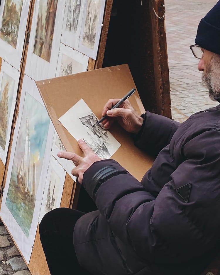 Candid Photo Of A Man Drawing On A Street 