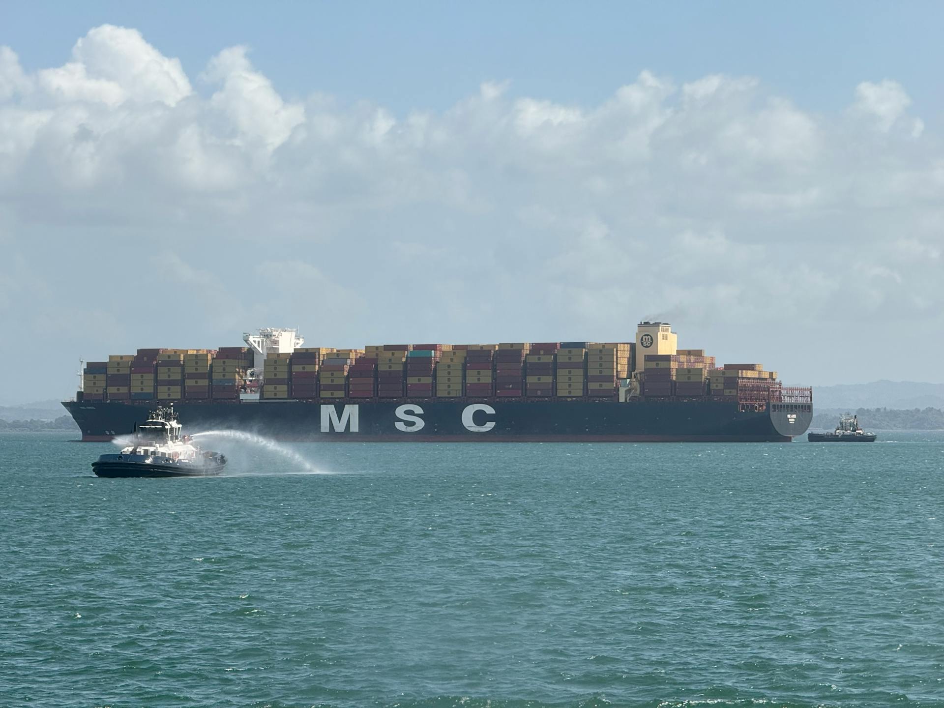 Container Ship Sailing with Pilot Boat