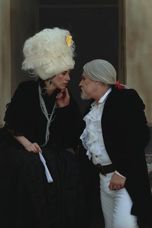 A man and woman in period costumes