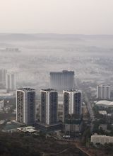 Pune's apartment-tower skyline blanketed in morning fog