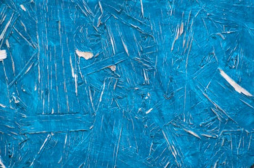 Blue paint on a wooden surface