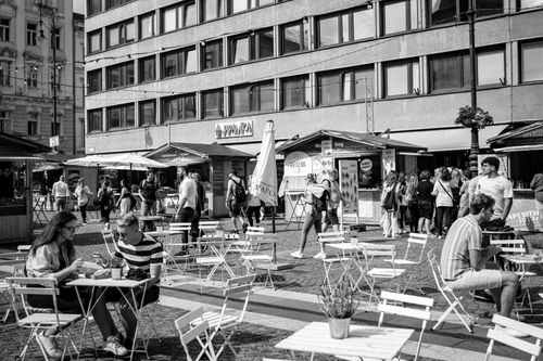 Free Black and white street scene of a lively outdoor cafe in Budapest, Hungary. Stock Photo