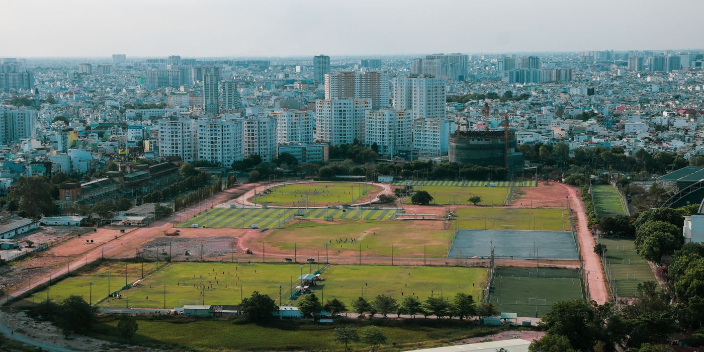 Aerial view of a football stadium beside a city, 2026 World Cup host market