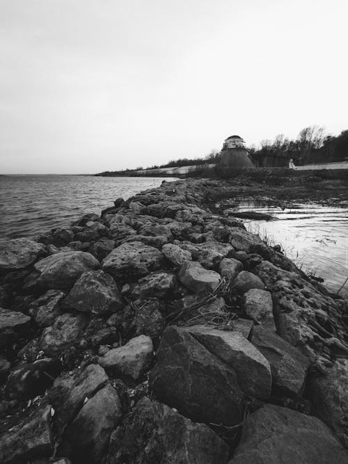 A black and white photo of a rocky shore