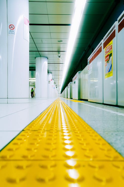 A yellow line in a subway tunnel
