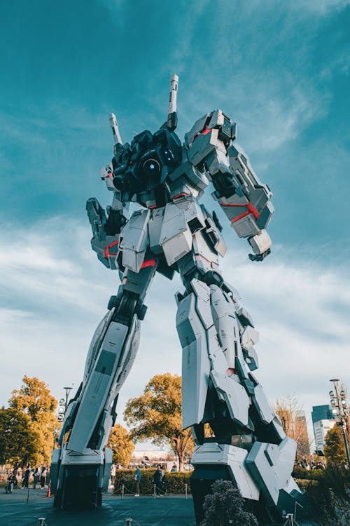 A large robot standing in the middle of a park